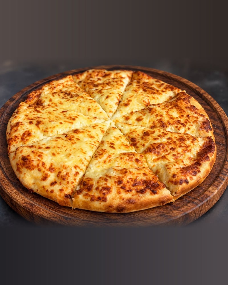 Megruli Khachapuri — Double-cheese bread — cheese inside and on top.